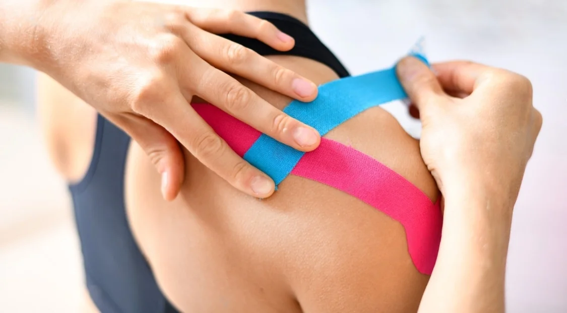 Kinesiology taping on an injured arm